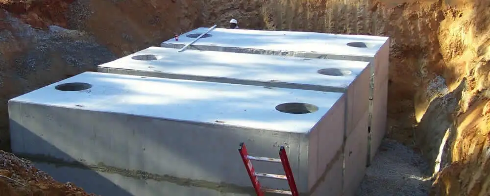 Septic tank installation site with a newly placed concrete tank in San Francisco, CA